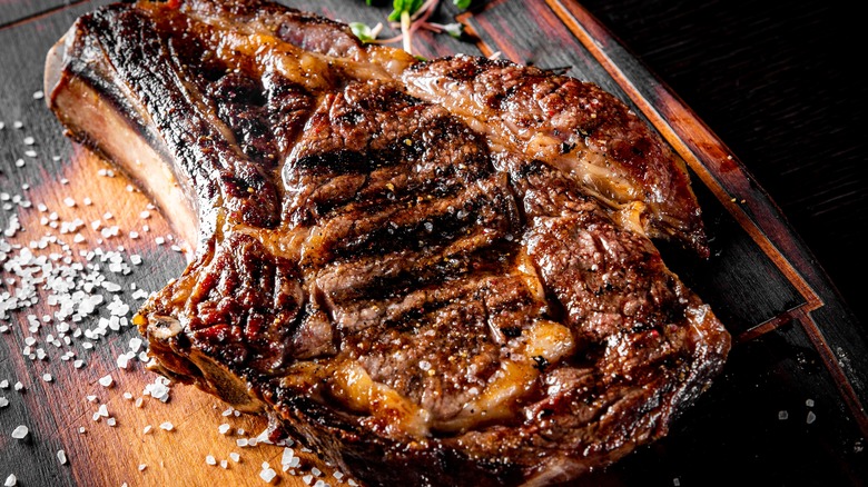 Large prepared steak on board