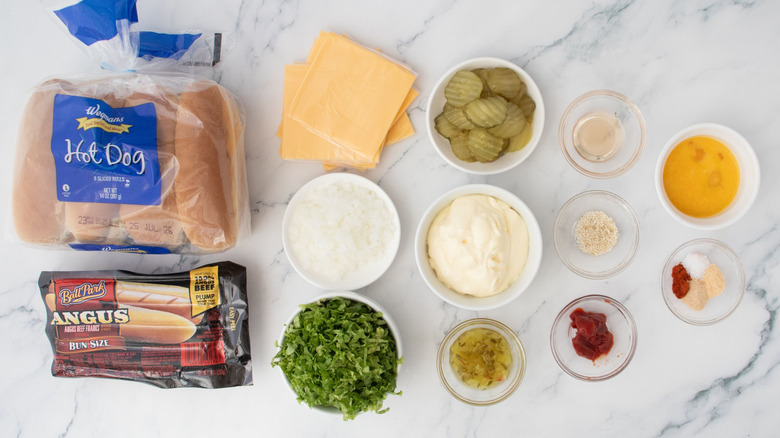 Big Mac hot dog ingredients on countertop