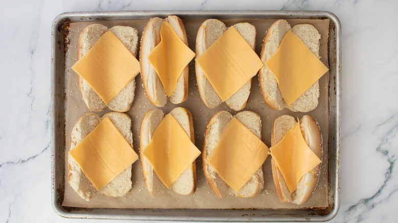 Hot dog buns filled with American cheese slices