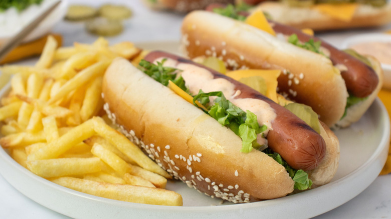 Big Mac hot dogs on plate with fries
