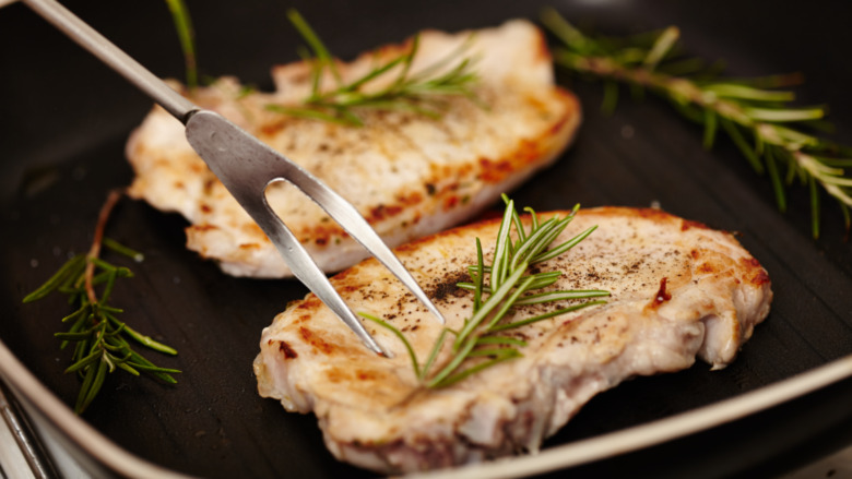 pork frying in a pan