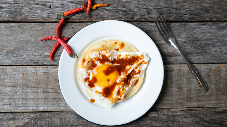 eggs with hot sauce on top