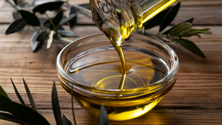 cooking oil pouring in bowl