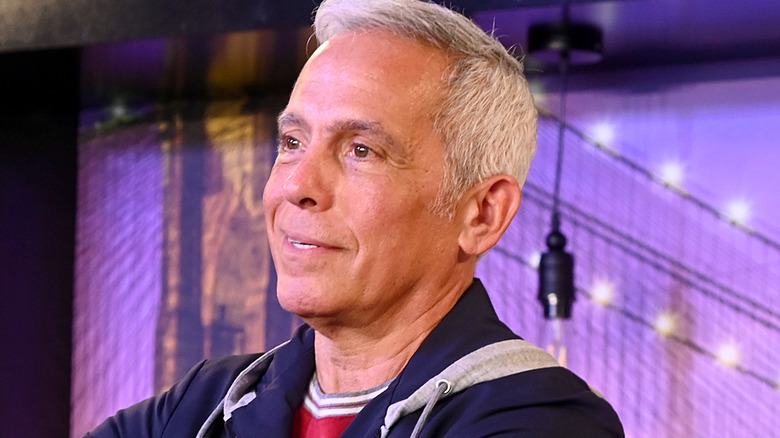 Geoffrey Zakarian doing a cooking demonstration on a set