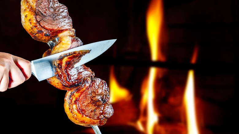 Meat being sliced at steakhouse 