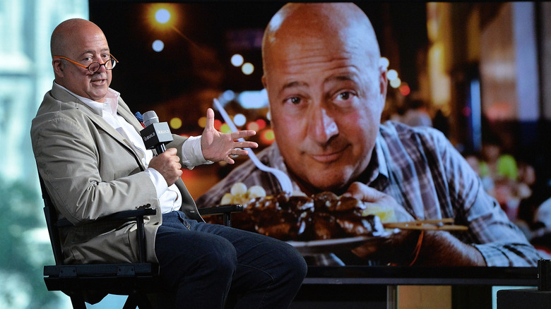 Andrew Zimmern discussing his show "Bizarre Foods" at an event