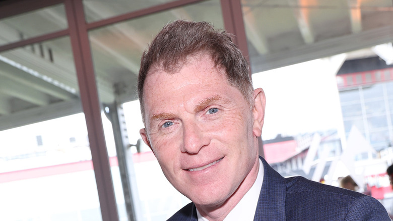 Bobby Flay grinning suit