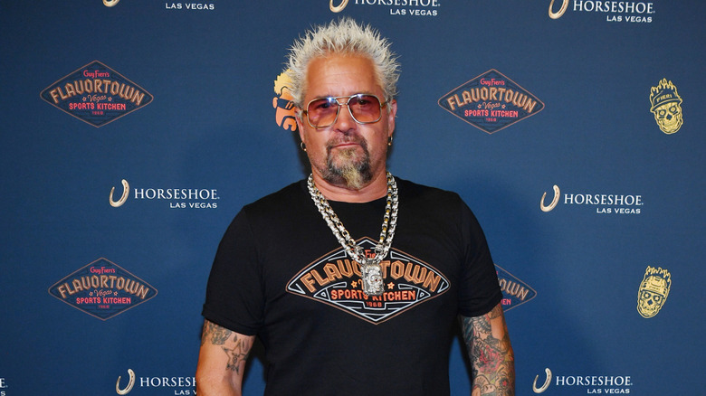 guy fieri posing for photo