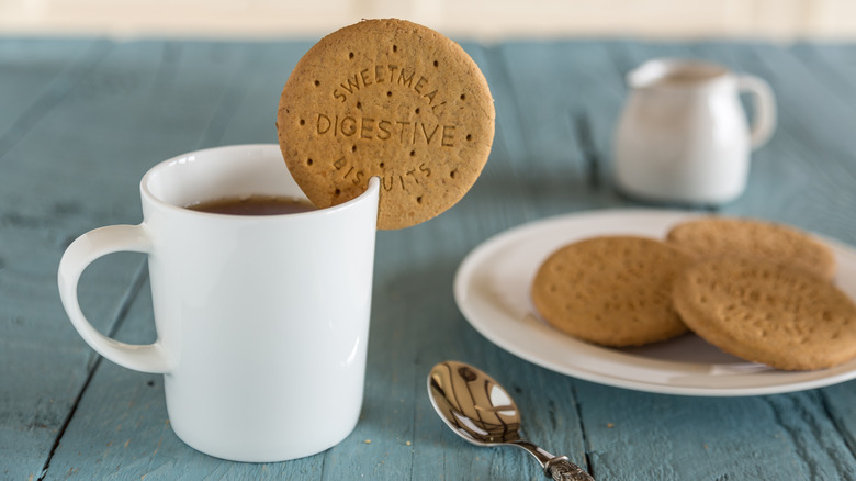 dunking British biscuits tea cup
