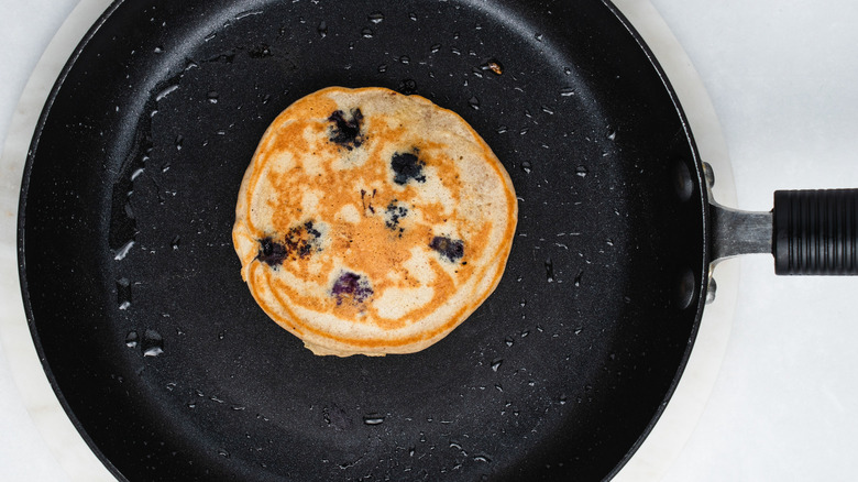 a finished pancake in frying pan