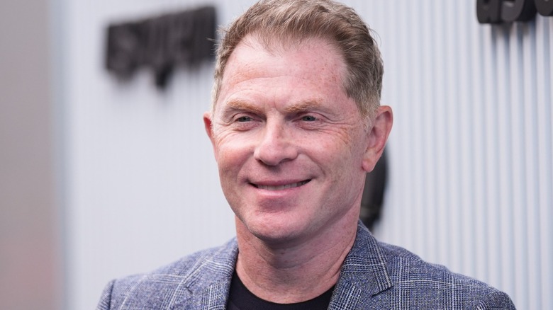 Food Network star and chef Bobby Flay in plaid blazer