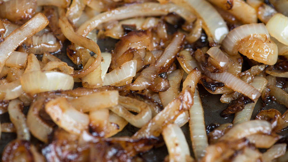 Onions caramelizing in a frying pan
