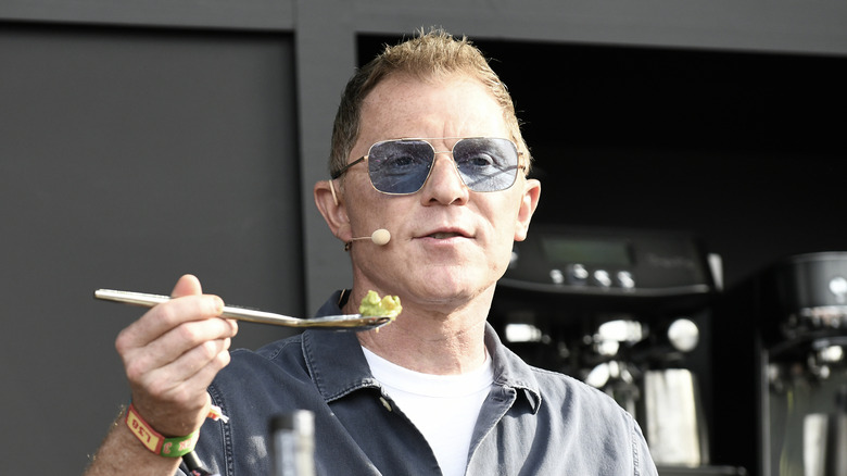 Closeup of Bobby Flay holding spoon