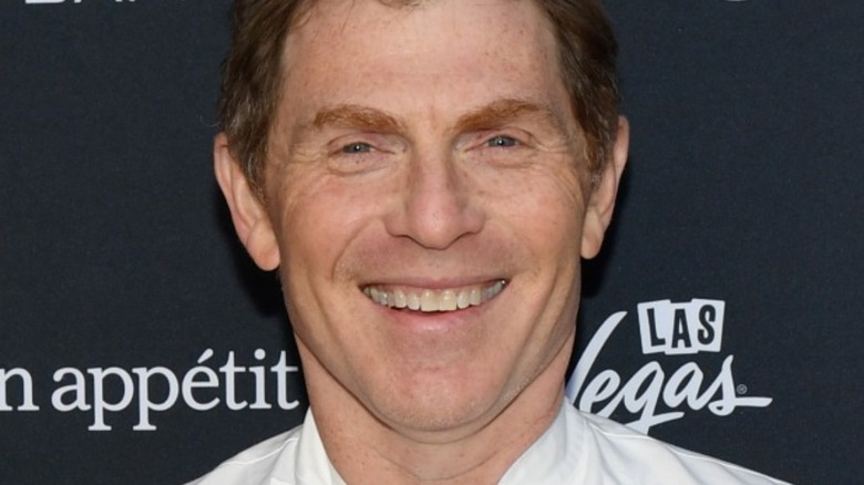 Bobby Flay smiling on red carpet