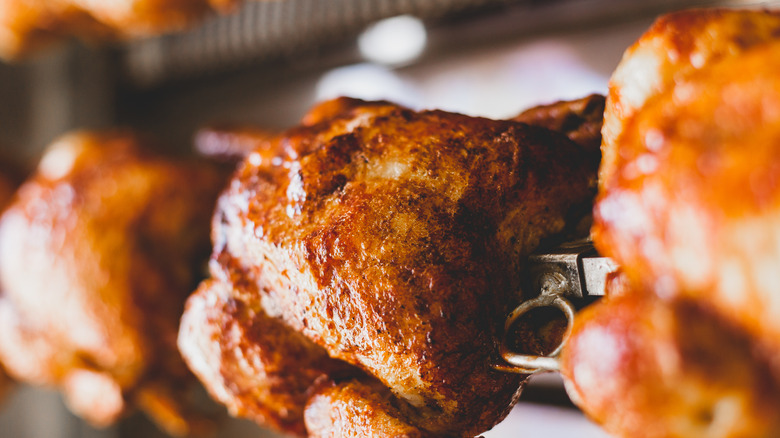 Chickens roasting on a rotisserie