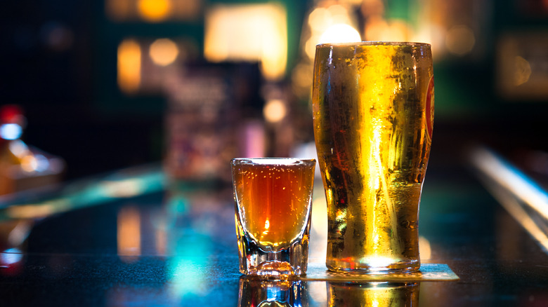 Bourbon shot and beer in glass