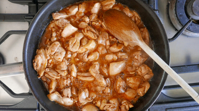 chicken cooking in sauce