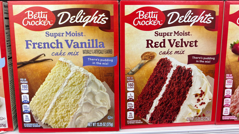Boxed cake mixes on store shelf