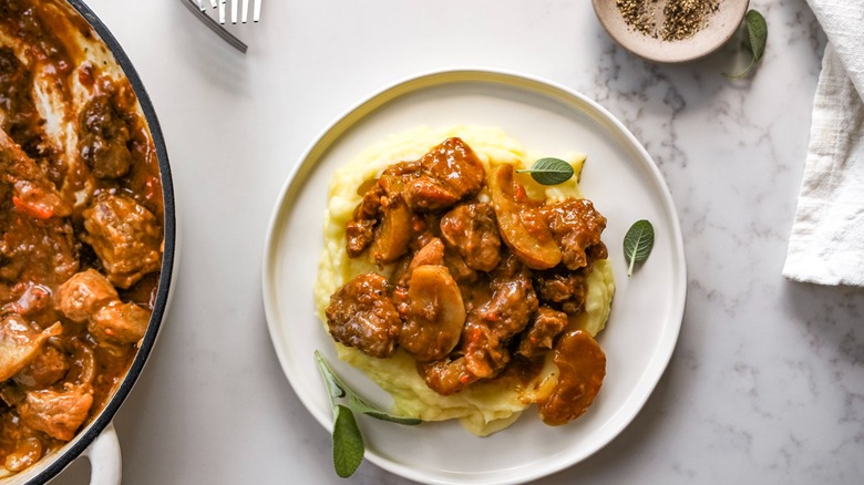 braised pork and apples over mashed potatoes