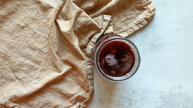 cherries and syrup in jar