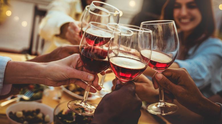 Friends toasting wine at dinner