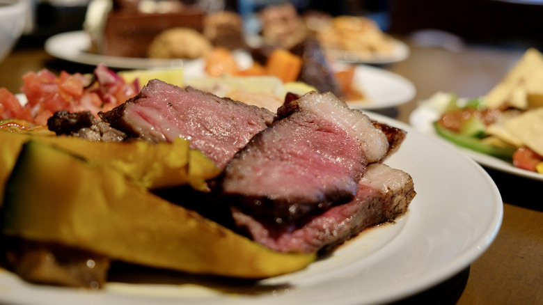 Buffet meal with steak