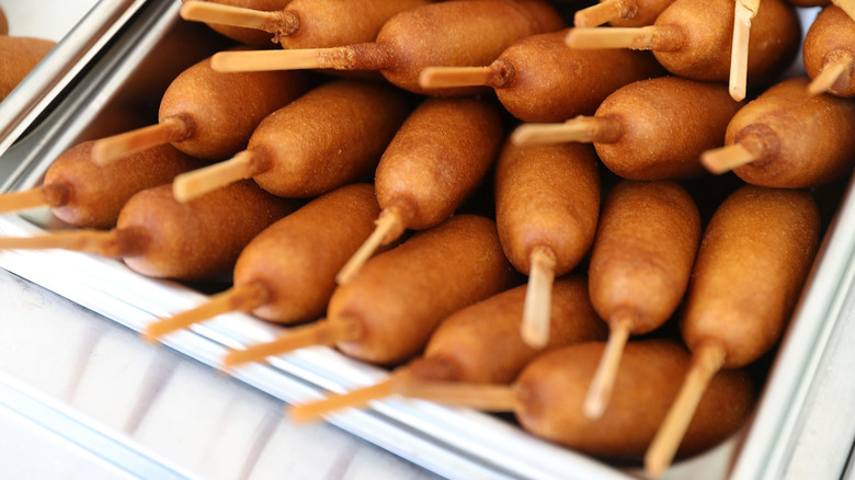 container filled with corn dogs