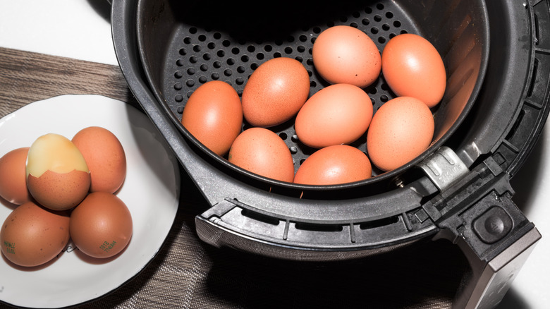 An air fryer filled with hard-cooked eggs