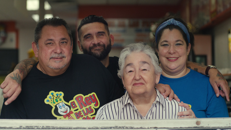 A group of restaurant workers posing together
