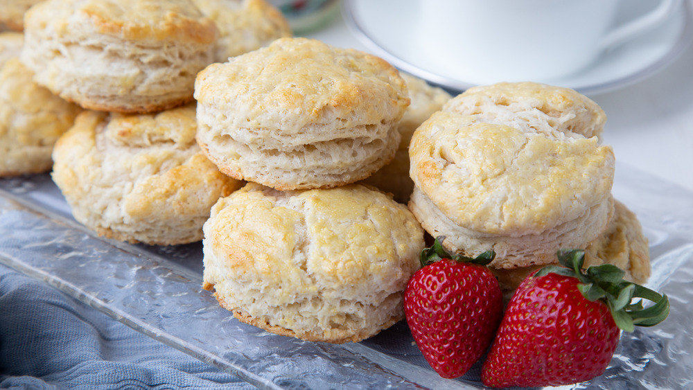 scones on glass plate with strawberries