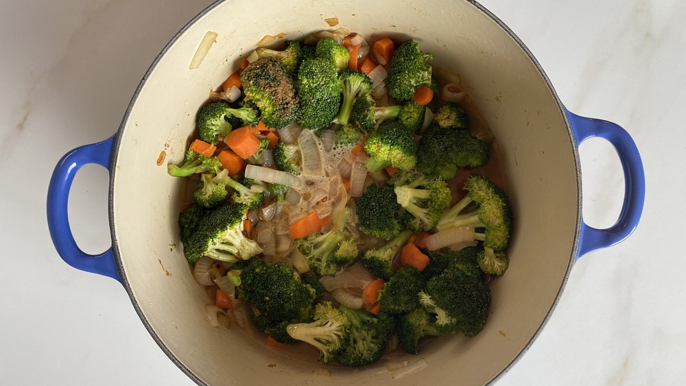 veggies added into the broccoli cheddar soup recipe pot