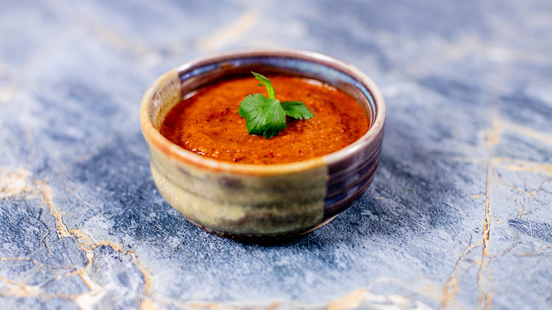 red salsa in brown bowl