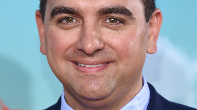 Close up of Buddy Valastro smiling in suit and tie