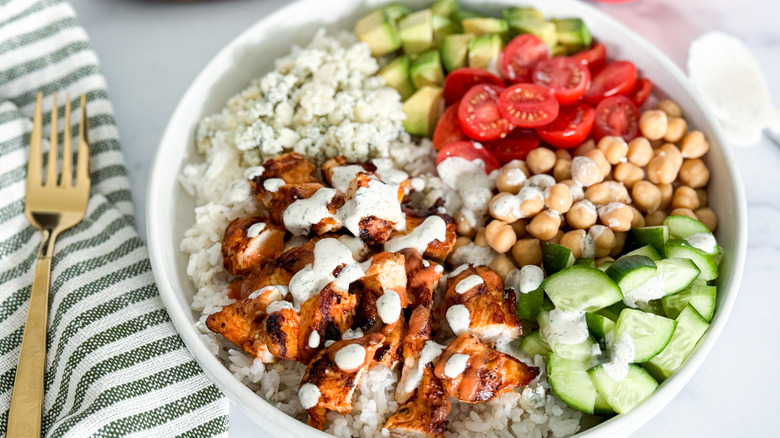 chicken and vegetable rice bowl with dressing