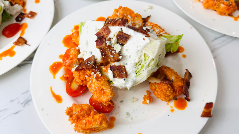 Buffalo chicken wedge salad on plate