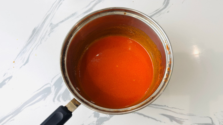 Buffalo sauce in saucepan