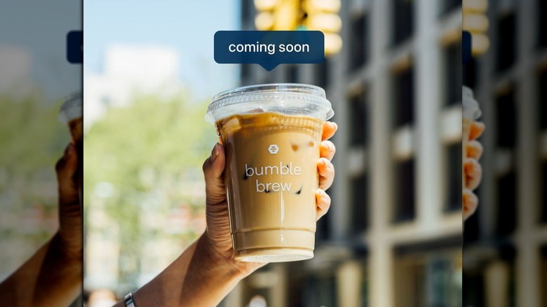 Bumble Brew cup in hand