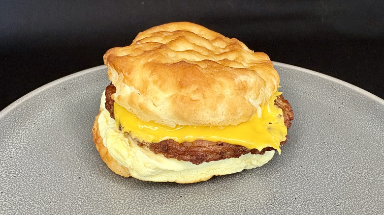 Sausage, egg, and cheese biscuit sandwich on gray plate