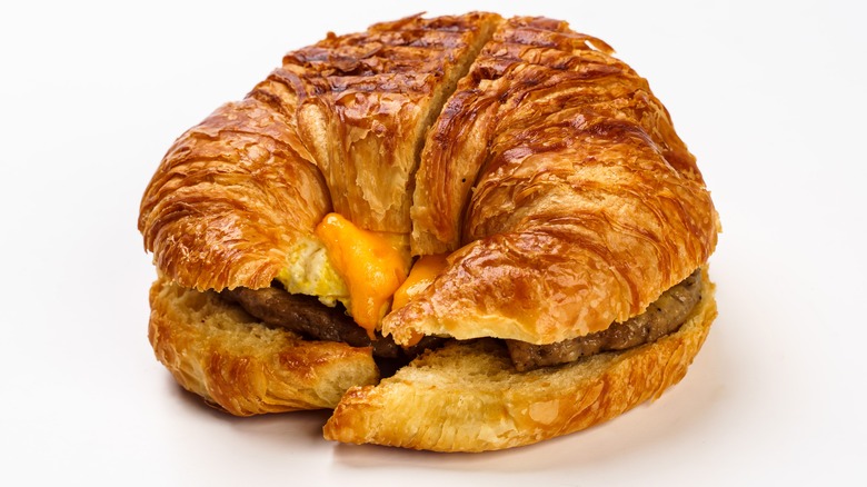 Croissant sandwich on white background