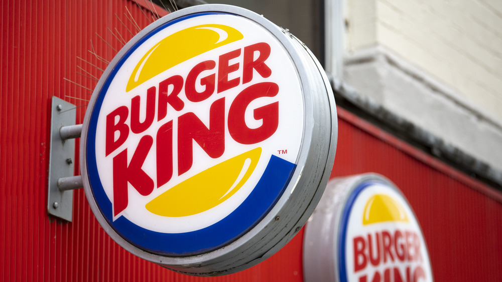 Burger King sign against red wall