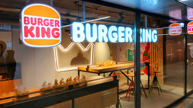 Burger King interior seen through glass walls.