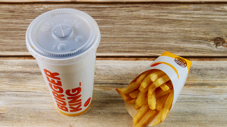 Burger King cup with plastic lid and fries