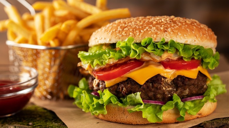 cheeseburger with fries on side