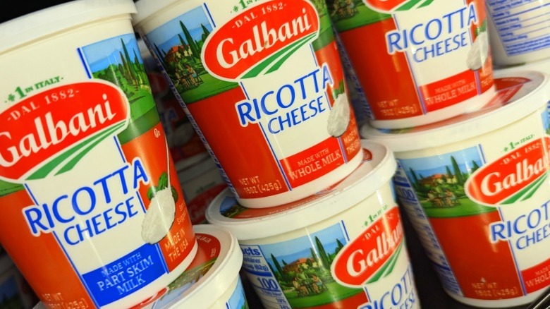 Containers of Galbani ricotta cheese on a supermarket shelf