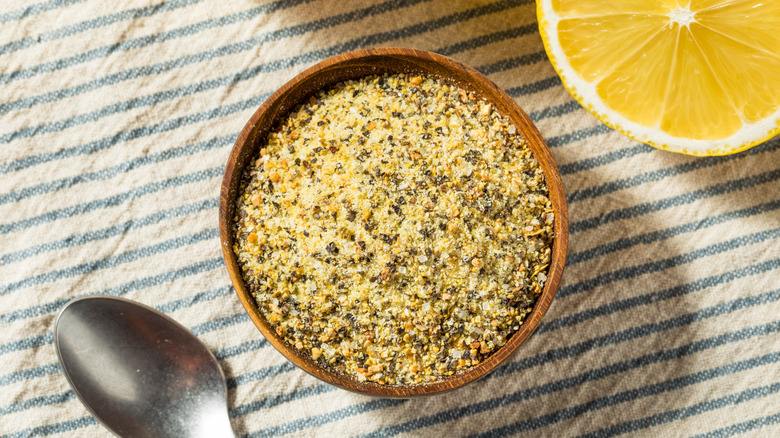 Lemon pepper seasoning in a small wooden bowl