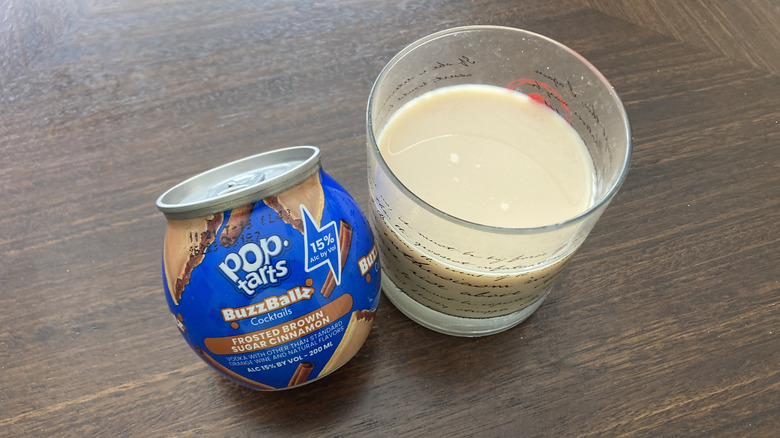 Pop-Tarts Brown Sugar Cinnamon BuzzBallz cocktail in a glass and the container