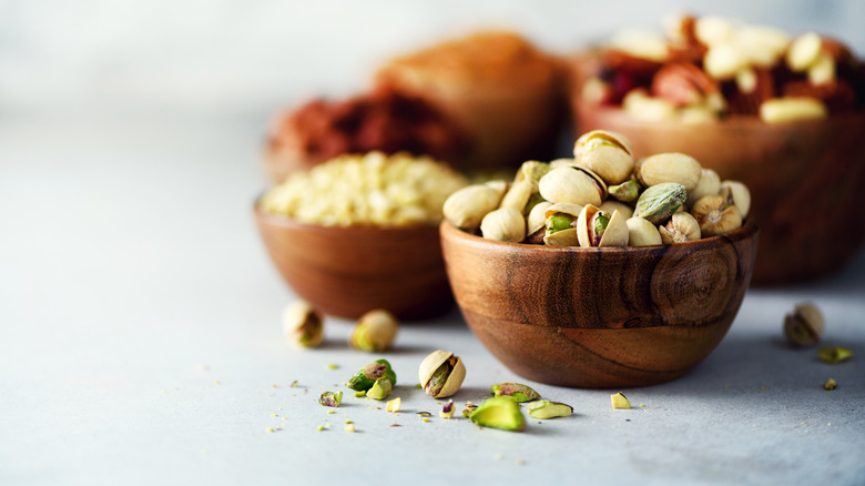 pistachios in bowl nut shells
