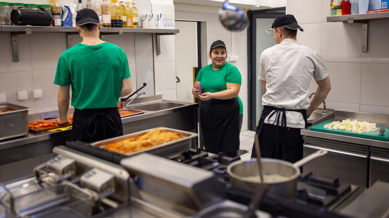 fast-food workers making food