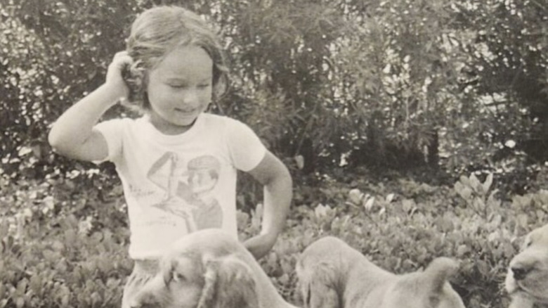 Young Giada De Laurentiis with puppies