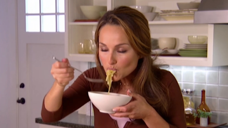 Giada De Laurentiis eating noodles from a bowl
